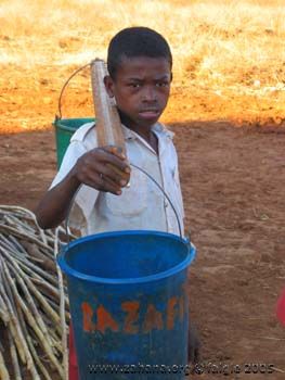 Boy getting water with bucket